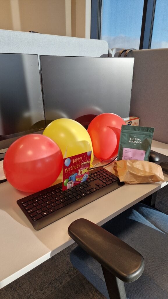 Work desk with balloons, ready for a fun break. Work desk with balloons, ready for a fun break.